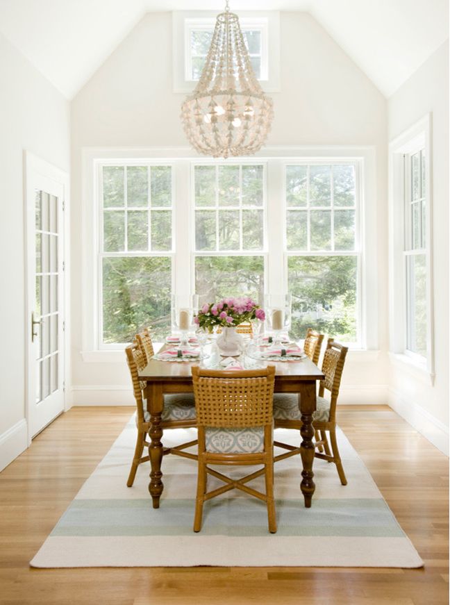 Vaulted dining area room with chandelier over table